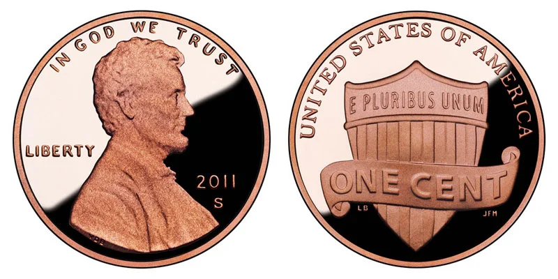 2011 penny grading strip showing four condition tiers from Worn through Circulated, Uncirculated, and Gem MS68