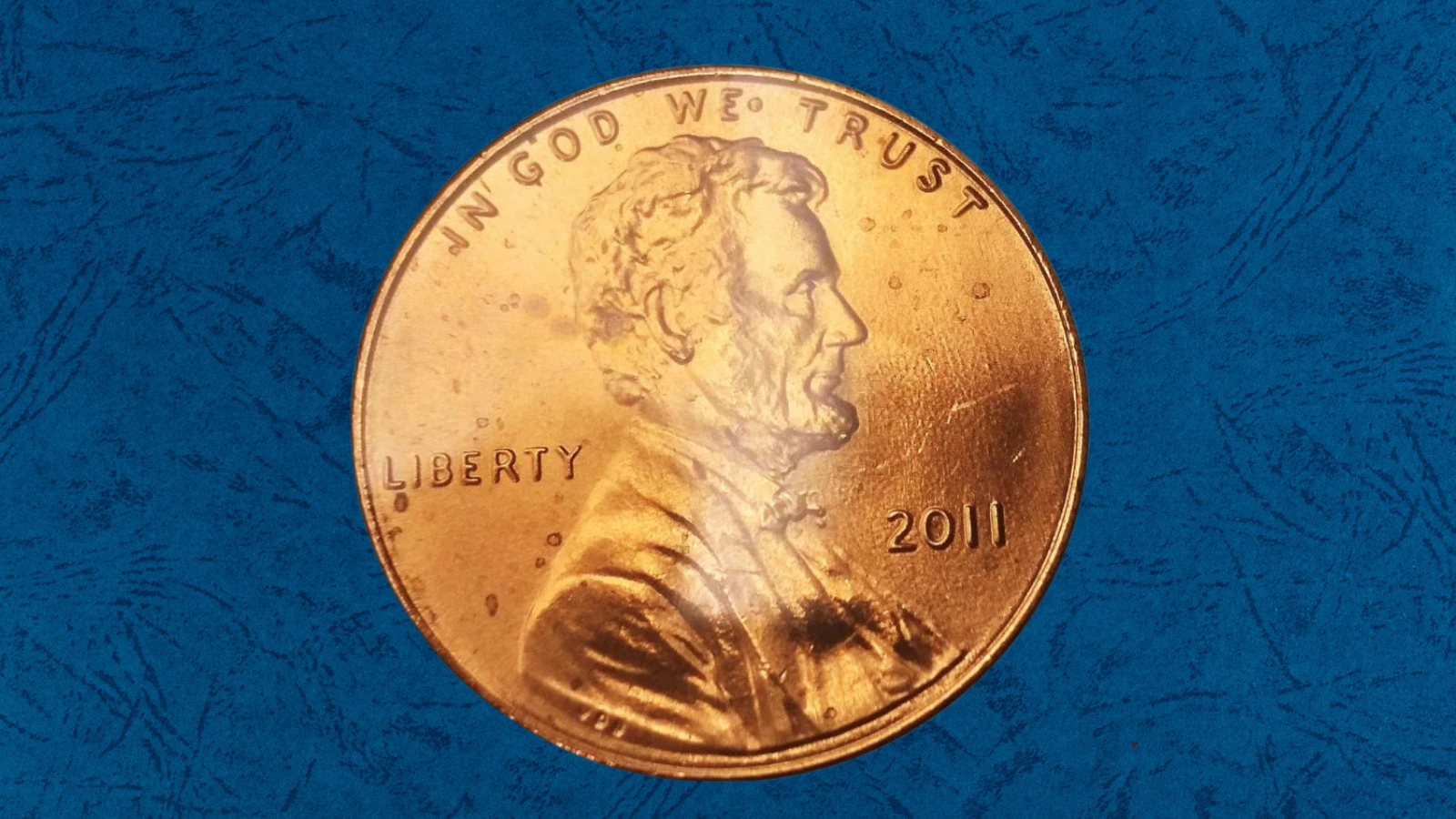 2011 penny die clash error showing ghost impression of Lincoln portrait on the shield reverse