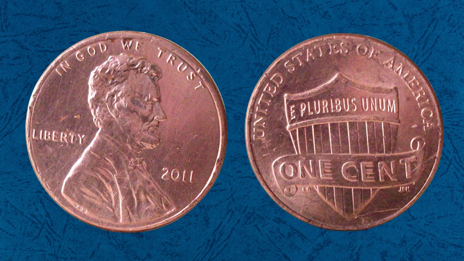 2011 penny off-center strike error showing design shifted with a blank crescent area visible