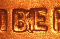 2011 penny BIE error showing raised vertical die crack between B and E in LIBERTY making it appear as LIBEITY